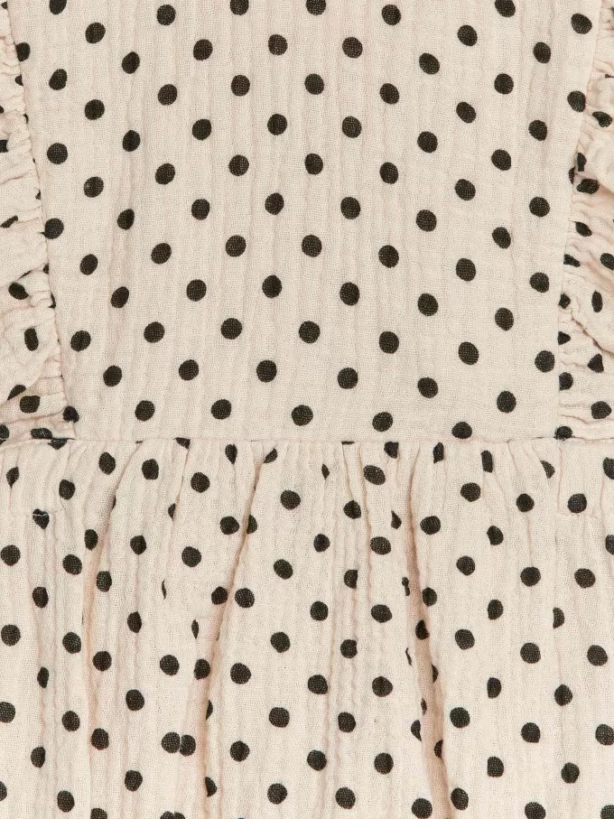 Strampler aus Musselin mit Rüschen